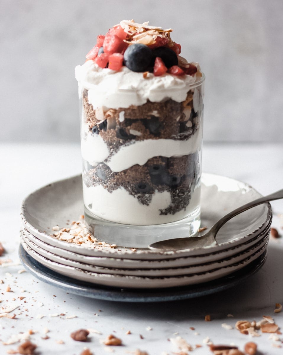 Low carb yogurt parfait with berries in a mason jar.