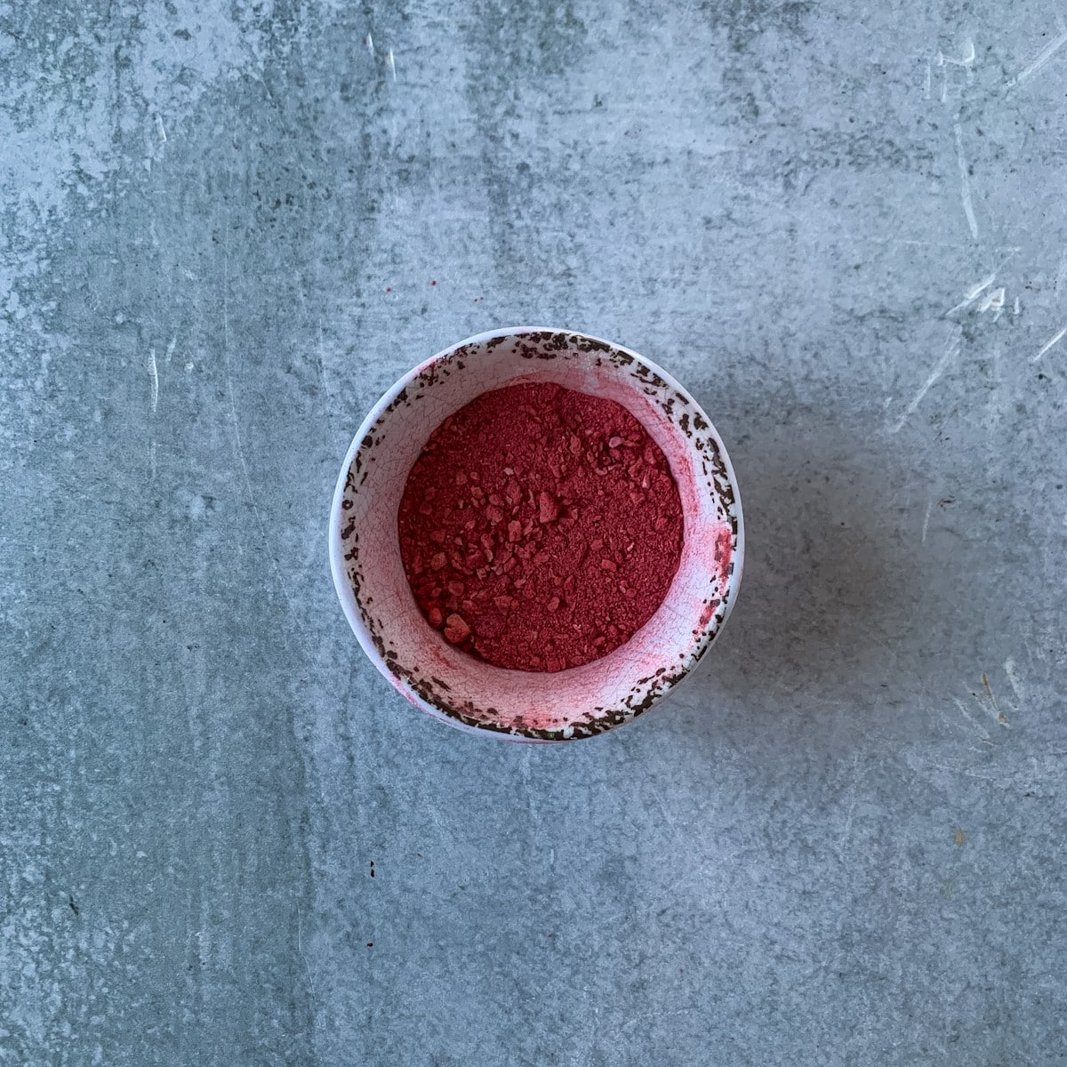 Bowl of ground up freeze dried strawberries